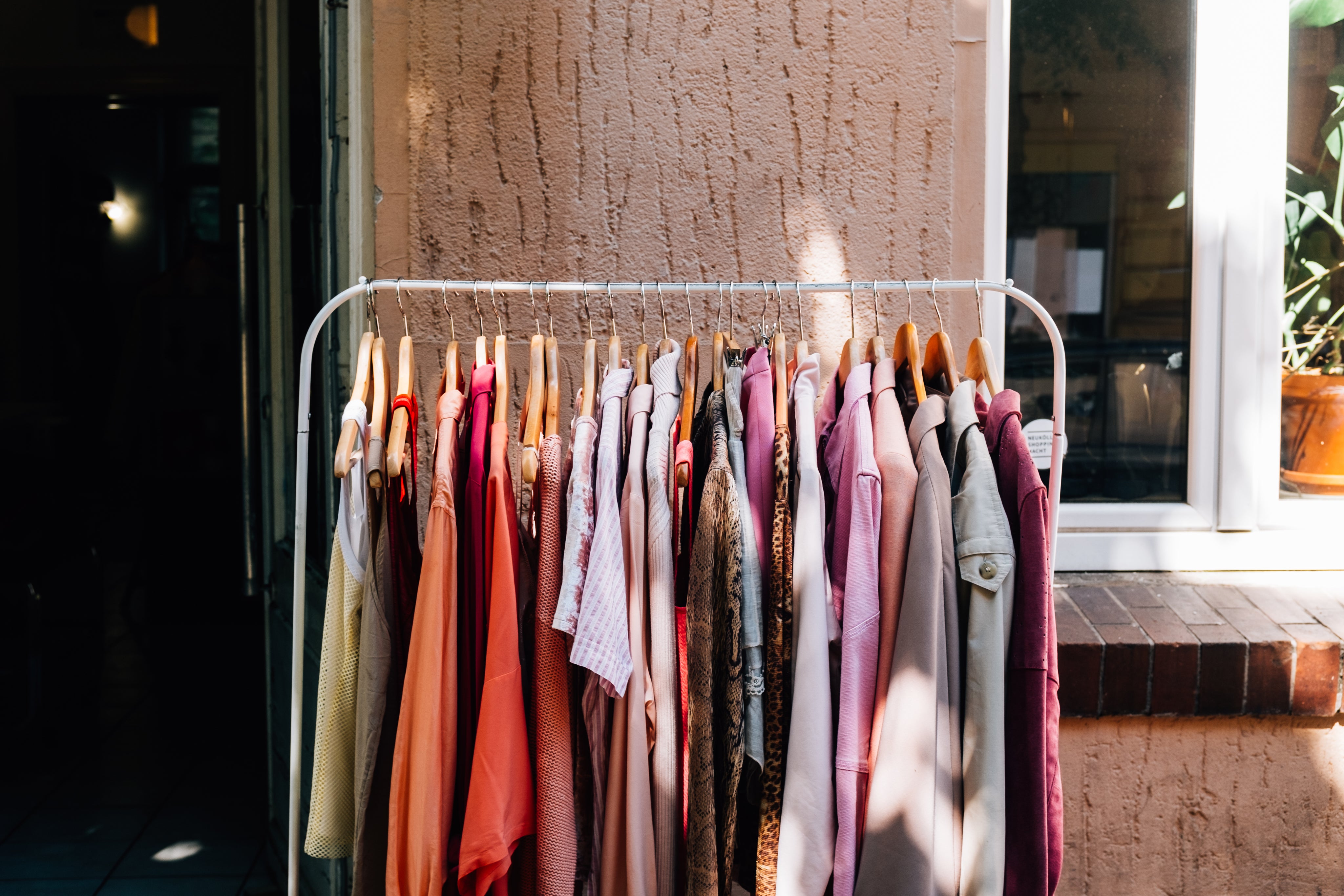 full-metal-clothing-rack-sits-outside-a-shops-entrance.jpg